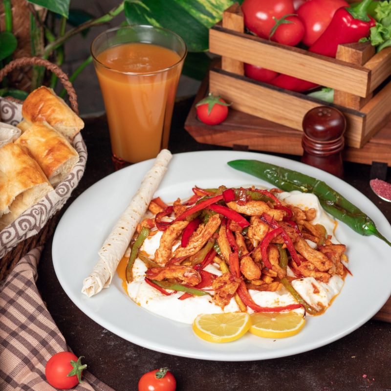 chicken-fajita-chicken-fillet-fried-with-bell-pepper-lavash-with-bread-slices-white-plate